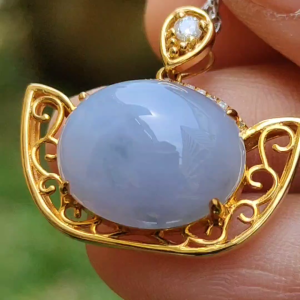 High Quality Lavender Natural Type A Jadeite Jade crafted as cabochon size 12.7 * 15.6 * 6 mm set on 18k gold with diamonds as Pendant certificate weighs 4.47 grams measurement 21.2 * 24.1 * 9 mm (18kp45)