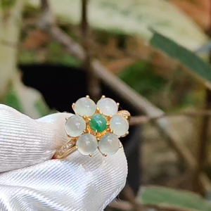 Very beautiful six Icy cabochon with good translucency Natural Type A Jadeite setting on G18k gold with 1 green cabochon forming a flower design ring and diamonds certificate included weigh 2.68 grams finger size 16.5mmdetails on description (18kring3)