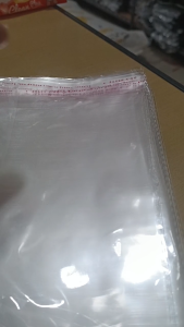 PLASTIK OPP SEAL LEM-PACKING BAJU - PER 100pcs
