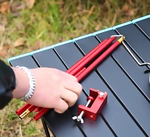 Outdoor lightweight camping pole /table stand with two foldable aluminum lantern hooks for hanging.