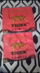 Kantong Plastik HD Tiger ukuran 3540 tebal warna merah