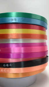 ริบบิ้นเนื้อทราย no.2 ตราลูกโป่ง ริบบิ้นพับเหรียญ ริบบิ้นพวงมาลัย บายศรี งานประดิษฐ์ DIY