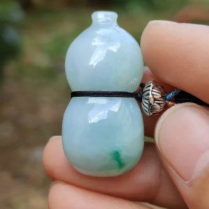 Light Green Natural Type A Jadeite Jade crafted with shape of Gourd as Pendant certificate weighs 8.42 grams measurement 32.9 * 16 * 8.4 mm(pendant252)