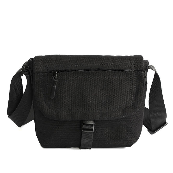 Black canvas sling outlet bag