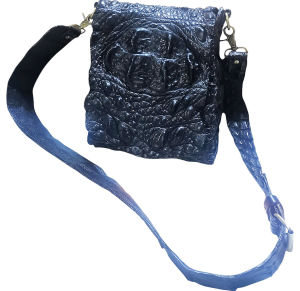 Super Black shoulder bag is a rolled crocodile leather bag.
