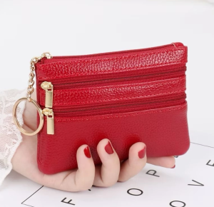 Mini coin purse made of PU leather soft and wear-resistant. Features double zipper pockets and inner compartments to hold coins cash ID and bank cards. Comes with a metal key ring and chain.