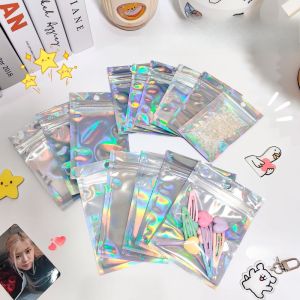 ถุงขนม ถุงซิป ถุงซิปโฮโลแกรม ถุงฟอยด์ โฮโลแกรม มีรูแขวน มแพ็ค 50 ใบี ถุงซิปล็อค ถุงฟอยด์ ถุงโฮโลแกรม หน้าใสหลังสายรุ้ง 7.5*12cm