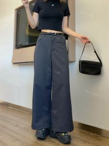 Womens pants and leggings with high-waisted design and side cutout detail.