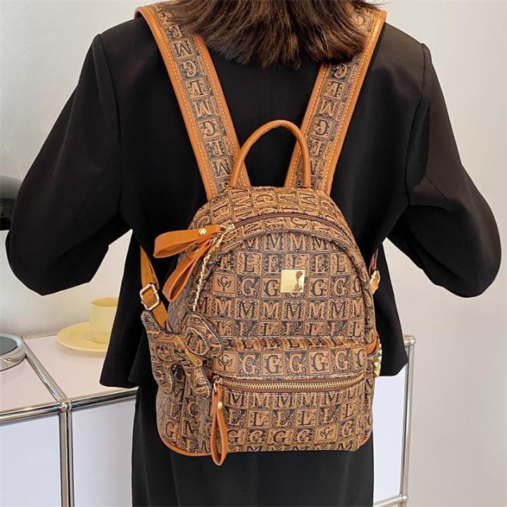 Riveted backpack women 2021 new fashion soft leather schoolbag Korean version large capacity versatile leisure travel backpack trend Lazada PH