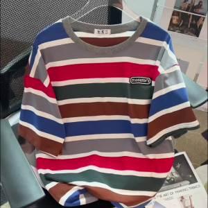 AMMIN เสื้อเบลาส์คอกลมทรงหลวมสำหรับผู้หญิงเสื้อเบลาส์คอกลมทรงหลวมสไตล์เกาหลีลายทางแขนสั้นสีเสื้อยืดผ้าฝ้ายล้วนสำหรับฤดูร้อน