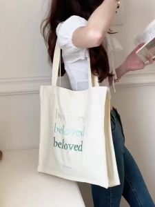กระเป๋าผ้าแคนวาสปักตัวอักษรเกาหลี กระเป๋าโท้ทผู้หญิง เรียบง่ายและหลากหลาย กระเป๋าสะพายไหล่ขนาดใหญ่สำหรับนักเรียน TMAY