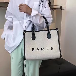 Túi xách nữ dung tích lớn 2025 Túi đeo chéo một vai vải canvas in chữ thời trang sành điệu mẫu mới hàng ngoại thương xuyên biên giới