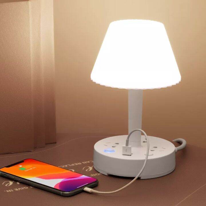 Desk lamp store with phone holder