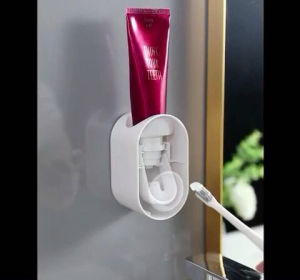 Adhesive toothpaste dispenser