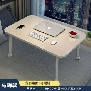 A folding desk on the bed a small table a good thing for dormitories a must-have for students a study desk a laptop desk a bedroom table board