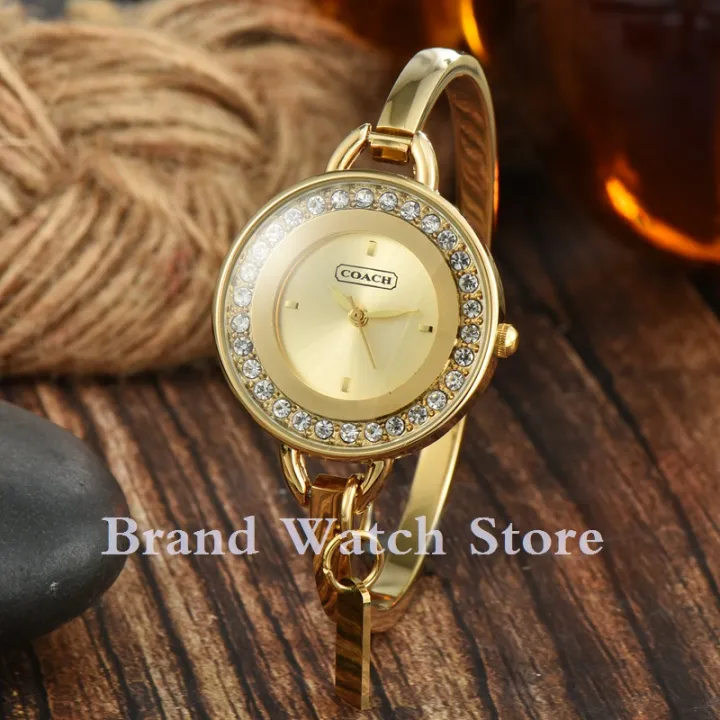 Coach gold watch womens sale