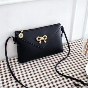 WENKEN BAGS#016 Women`s MINI lightweight crossbody sling bag with thin crossbody straps knotted at the sides.