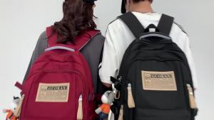 Multi-layer spine-protecting backpack with large capacity and versatile design 2026 New travel bag for junior high and high school students