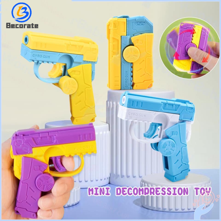 BECORATE Mini decompression rotating rebound toy Gun two-in-one fidget ...