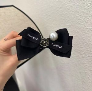 Camellia Bowknot Hair ClipHigh-end ถือความเป็นผู้หญิงหลังศีรษะสูงหางม้าหัวลูกชิ้น