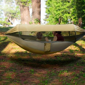 Ultimate Outdoor Double Hammock with Mosquito Net - Heavy-Duty Nylon Fabric Easy Setup with Sturdy Frame Compatibility Spacious Two-Person Camping Bed- Lightweight & Portable Design Green & Golden Color OptionsEasy Assembly for Hassle-Free Setup