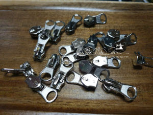 Đầu dây kéo số 7 thay dây kéo răng cước xi trắng gói 10 cái