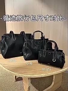 Songmont[ Lý Na ] Cặp công sở da bò thuộc thảo mộc màu đen nhẹ thuộc dòng túi du lịch Yousong Xunzi.