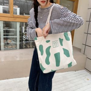 🌼Cute Shop🌼 กระเป๋าสะพายข้างลายนมวัว2753 ผ้าหนาเกรดดีที่สุดใบใหญ่มากไส่โน๊ตบุ๊คได้ กระเป๋าใบใหญ่ กระเป๋าสะพายข้าง