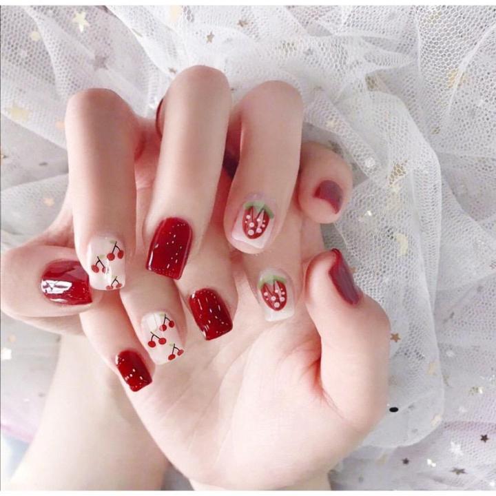 Vibrant Kuku Nail Art with Red Flair