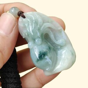 Crafted as Octopus Pendant on Natural Type A Jadeite Jade with rough skin certificate weighs 20.48 grams measurement 38.6 * 20.3 * 17 mm (pendant354)