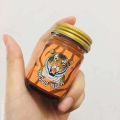 Thong Tiger ขนาด 50g (ยาหม่องตราเสือแก้ปวดเมื่อย) ( 1 ขวด ). 