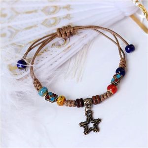 Ethnic Style Pine Cone Pendant Bracelet Distressed Pentagram Ceramic Beaded Bracelet Boho Style Beaded Bracelets With Star Charms Adjustable Cord. Colorful Beads Earthy Tones Metal Accents Versatile Accessory. Casual Bohemian Fashion.