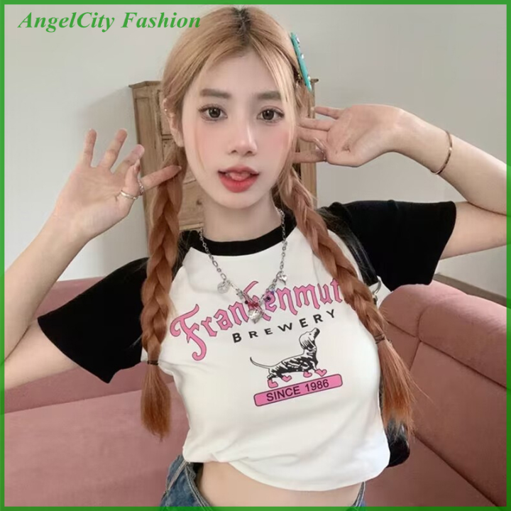 AngelCity เสื้อยืดแขนแร็กแลนพิมพ์ลายอเมริกาแบบย้อนยุคเสื้อผู้หญิงคอกลม ...