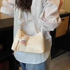 Túi bánh bao nữ cầm tay vân nhám phong cách độc đáo 2026 Túi đeo chéo nữ kiểu baguette mẫu mới thiết kế đẹp mắt