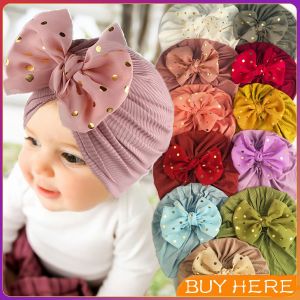หมวกบีนนี่ผ้าโพกหัวประดับโบว์ หมวกเด็กแรกเกิดโบว์ใหญ่ น่ารักเกินปุยมุย   baby hat BUY HERE