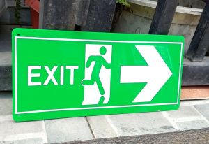 Green exit sign with white arrow and running figure. 3mm acrylic material. Non-luminous. Wall decor for home.