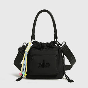 ALO Yoga Drawstring Bucket Bag for Women Waterproof NylonHandbag Embossed Logo Colorful Tassel Charm Detachable Wide Logo‑Print Crossbody Strap Casual Sports Shoulder Bag