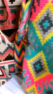 Wayuu Mochila Sling Bag from Colombia - Large Size\\n\\n Introduction to Wayuu Mochila\\n\\nThe Wayuu Mochila is a unique handcrafted accessory from Colombia, known for its vibrant colors and intricate patterns. Originating from the Wayuu people, this large size Colombian bag has become a popular choice among travelers and fashion enthusiasts alike.\\n\\n What is a Wayuu Mochila?\\n\\nA Wayuu Mochila is a traditional handwoven bag made by the indigenous Wayuu people of Colombia. These bags are known for their distinctive patterns and colors, which are inspired by the Wayuu culture and environment. Each bag is handmade, making them one-of-a-kind pieces of art.\\n\\n Origins and Cultural Significance\\n\\nThe Wayuu people are an indigenous group living in the Guajira Peninsula in northern Colombia. They have been weaving baskets and bags for centuries, and the Wayuu Mochila has become a symbol of their rich cultural heritage. The patterns and colors used in the mochilas represent different aspects of Wayuu life, such as their connection to nature and their spiritual beliefs.\\n\\n Features of the Large Size Colombian Bag\\n\\n Design & Materials\\n\\nThe large size Wayuu Mochila is designed to be both stylish and functional. It features a spacious interior, perfect for carrying all your essentials while traveling. The bag is made using natural fibers, such as cotton and wool, which are dyed using natural dyes. The intricate patterns are created using a technique called \"crocheting,\" which involves looping yarn together to form a fabric.\\n\\n Durability & Versatility\\n\\nDespite its delicate appearance, the Wayuu Mochila is surprisingly durable and versatile. The natural fibers used in its construction make it resistant to wear and tear, while the spacious interior allows for easy organization of your belongings. The bag can be worn as a sling backpack, crossbody bag, or even as a clutch, making it a versatile accessory for any occasion.\\n\\n Ethical & Sustainable Production\\n\\nThe Wayuu Mochila is not only beautiful but also ethically and sustainably produced. By purchasing a Wayuu Mochila, you are supporting the livelihoods of the Wayuu artisans who create these bags. Additionally, the natural fibers and dyes used in the production process make the bag an eco-friendly choice.\\n\\n How to Use Your Wayuu Sling Backpack for Travel\\n\\n Packing Tips\\n\\nWhen packing your Wayuu sling backpack for travel, it's important to consider the size and weight of your belongings. The large size Colombian bag is perfect for carrying all your essentials, including clothing, toiletries, and electronics. To maximize space, roll your clothes instead of folding them, and use packing cubes to keep everything organized.\\n\\n Staying Organized on the Go\\n\\nStaying organized while traveling can be challenging, but the Wayuu sling backpack makes it easier. With its spacious interior and multiple pockets, you can easily store and access your belongings. Keep your most frequently used items, such as your phone and wallet, in the front pocket for quick access.\\n\\n Showcasing Your Cultural Appreciation\\n\\nBy wearing a Wayuu sling backpack, you are showcasing your appreciation for Colombian culture and supporting the livelihoods of the Wayuu artisans who create these bags. The vibrant colors and patterns of the bag will add a touch of uniqueness to your outfit, making you stand out from the crowd.\\n\\n Care Instructions for Handcrafted Wayuu Mochila\\n\\n Cleaning & Maintenance\\n\\nTo maintain the beauty and longevity of your Wayuu Mochila, it's important to clean and care for it properly. Spot clean the bag using a damp cloth and mild detergent, then air dry it away from direct sunlight. Avoid exposing the bag to excessive moisture or heat, as this can damage the natural fibers.\\n\\n Storage Tips\\n\\nWhen not in use, store your Wayuu Mochila in a cool, dry place away from direct sunlight. To prevent creasing, stuff the bag with tissue paper or a soft cloth before storing it.\\n\\n Extending the Life of Your Wayuu Bag\\n\\nTo extend the life of your Wayuu Mochila, avoid overloading it with heavy items, which can cause the bag to stretch or tear. Additionally, avoid exposing the bag to harsh chemicals or abrasive surfaces, as these can damage the natural fibers.\\n\\n Conclusion: Embrace the Beauty of Ethnic Colombian Accessories\\n\\nThe Wayuu Mochila is a unique and beautiful accessory that combines style, functionality, and cultural significance. By purchasing a Wayuu sling backpack, you are supporting the livelihoods of the Wayuu artisans who create these bags, while also showcasing your appreciation for Colombian culture. Whether you're traveling or simply looking for a stylish accessory, the large size Wayuu Mochila is a must-have for any fashion enthusiast.\"\n}