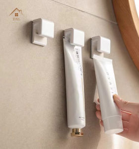 DXL Toothpaste Holder Rack Punch-free Wall-mounted Facial Cleanser Skin Care Products Bathroom Wall Storage Clip