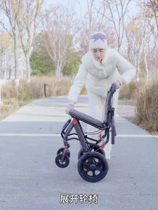 Small folding wheelchair ultra-thin and portable suitable for airplane travel women elderly people commuting handcart