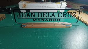 DESK NAME PLATE ACRYLIC VINYL CLEAR AND WITH BACKGROUND. 12”X3” 4mm base 3mm width. BLACK FONTS CLEAR BACKGROUND. P400.