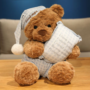 Cute plush bear doll in a blue plaid pajama perfect as a cuddly pillow a gift for girls