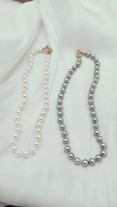 Spring and summer long faux pearl necklace collarbone chain for women niche design light luxury new popular style high-end feel early spring accessory