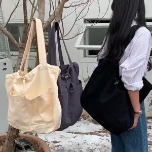 Túi vải canvas dây rút đơn giản phong cách Nhật Bản và Hàn Quốc dung tích lớn phong cách Harajuku. ins Túi đeo vai bằng vải canvas thời trang giản dị đa năng