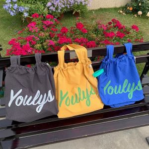 SOTOP จุได้มาก ถุงสิริ drawstring สไตล์เกาหลีแบบ ผ้าใบแคนวาส กระเป๋าถือพิมพ์ลายตัวอักษร ลำลองแบบสบายๆ ถุงช้อปปิ้งถุง กระเป๋าสะพายไหล่ไนลอน สำหรับผู้หญิง