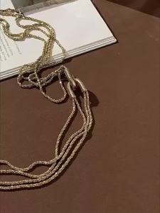 Long multi-layered necklace for women featuring European and American light luxury and niche design with a sophisticated and r