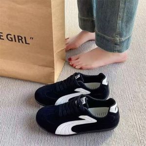 White sneakers with laces and suede accents Casual footwear for everyday wear Pair with jeans for a relaxed look