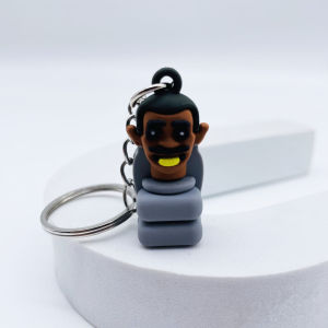 พวงกุญแจ จี้ตุ๊กตาผู้ชาย มอนิเตอร์ห้องน้ํา Titan Audioman TV Man พวงกุญแจชักโครก PVC ตุ๊กตา Camara Man