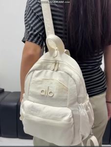 ALO Women Multi‑Compartment Nylon Backpack Side Mesh Pockets Adjustable Padded Shoulder Straps Casual Daypack For School And City Travel
