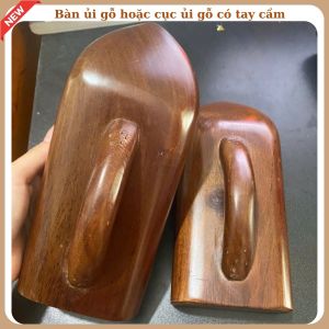 Bàn ủi gỗ hoặc cục ủi gỗ có tay cầm dùng để đập vải sau khi dùng bàn ủi điện